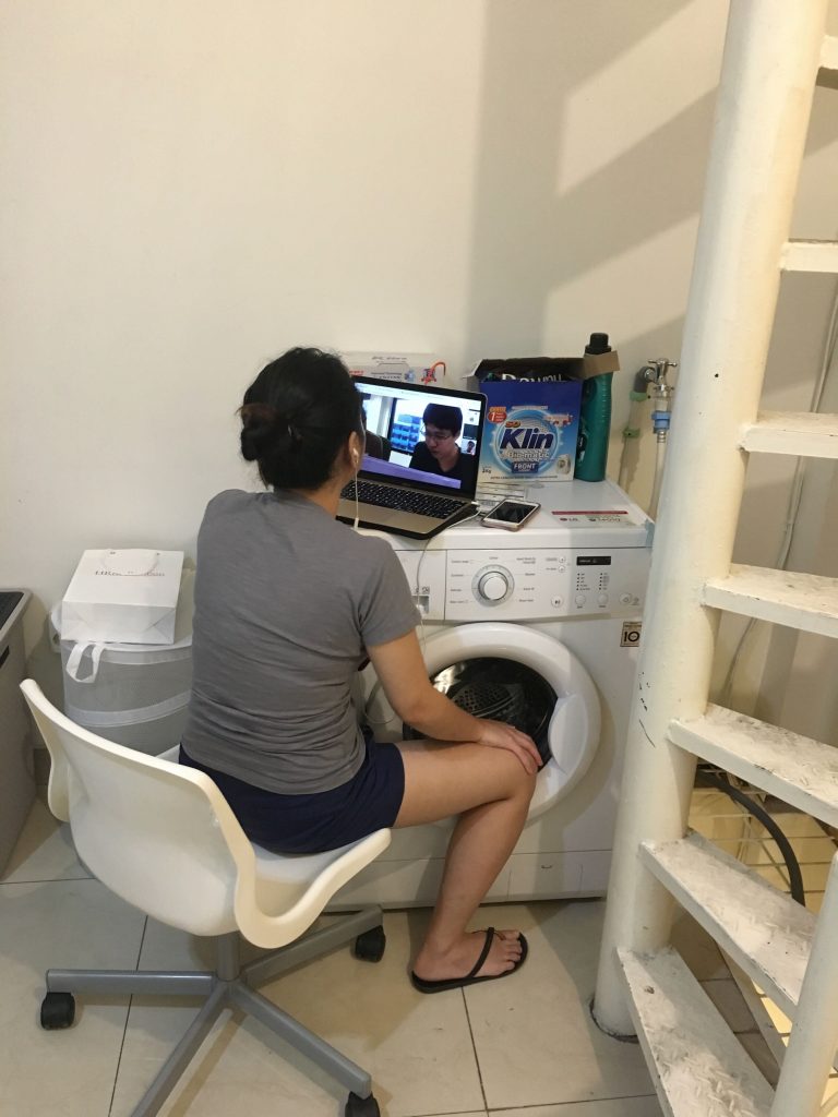 working from a shophouse laptop over a washing machine